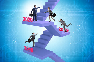 Businessman climbing stairs on yearly basis