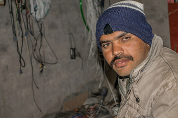 staring poor farmer in a village looks so worried or sad 