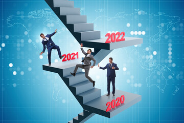 Businessman climbing stairs on yearly basis