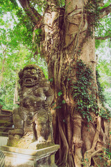 Statue next to a tree