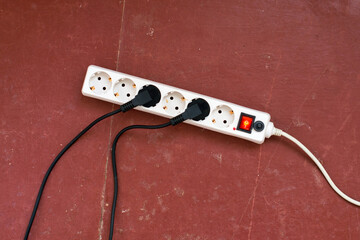 Extension cable with connected wires on the floor