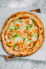 hot italian pizza on marble table