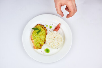 White plate with rice and and fish
