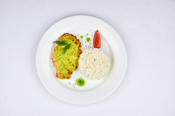 White plate with rice and and fish