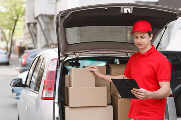 Courier checks parcels and online orders in tablet