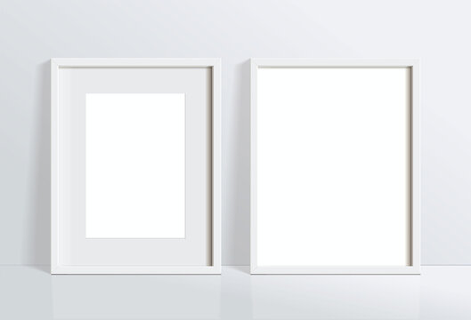 Set minimal empty vertical white frame picture mock up hanging on white wall background with window light and shadow. isolate vector illustration.