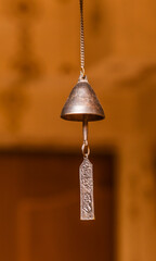 Obraz premium Indian brass bell hanging on a chain