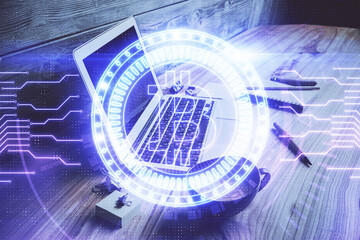 Multi exposure of blockchain and crypto economy theme hologram and table with computer background. Concept of bitcoin cryptocurrency.