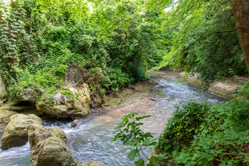 black river that comes from the marmore waterfalls