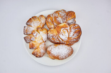 sweet bun on a plate with a white background