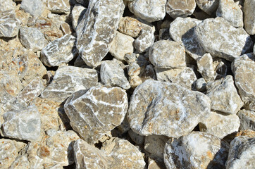 Natural gray gypsum stone. Close up image of stones with black and white. Industrial mining area. Limestone mining, quarry - Imagen