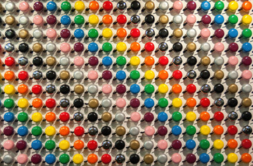 wall decorated with colorful bicycle bells
