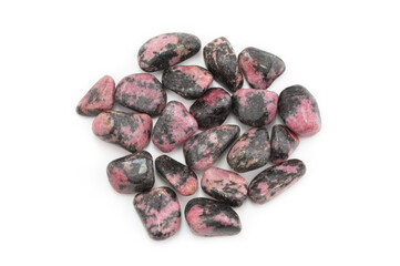 Closeup of rhodonite gemtsones or tumbled stones isolated on white background