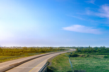 Road panorama on sunny spring day with lovely sky.