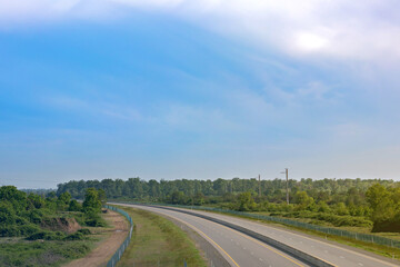 Road panorama on sunny spring day with lovely sky.