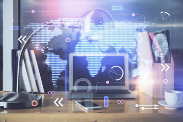 Multi exposure of table with computer and world map hologram. International data network concept.