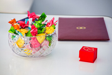 candies and wedding rings on the table