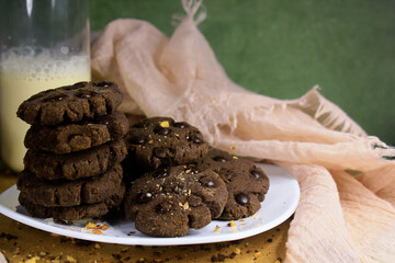 cookies with chocolate granules served with a glass of milk are very appropriate served as morning snacks, have a lot of protein, carbohydrates as well as sugar as an energy supply