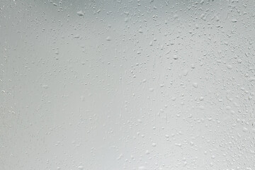 wet glass background condensate / abstract rain, drops texture on transparent glass