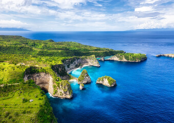 Aerial view at sea and rocks. Turquoise water background from top view. Summer seascape from air....