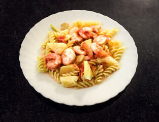 Seafood pasta in sweet and sour sauce
