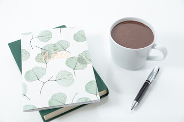 cup of chocolate and notebook