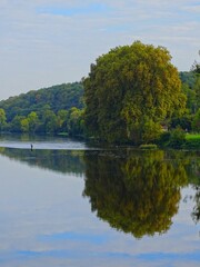Europe, France, New Aquitaine, Charente, Village of Confolens, fisherman on the river La Vienne