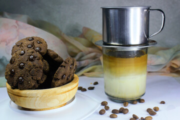 Chocolate granules cookies served with strong Vietnamese drip coffee, bitter coffee and sweet cookies are best served when relaxing such as reading a book or when we need energy
