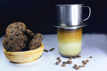 Chocolate granules cookies served with strong Vietnamese drip coffee, bitter coffee and sweet cookies are best served when relaxing such as reading a book or when we need energy