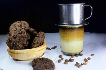Chocolate granules cookies served with strong Vietnamese drip coffee, bitter coffee and sweet cookies are best served when relaxing such as reading a book or when we need energy