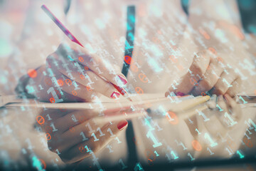 Double exposure of woman's writing hand on background with data technology hud. Big data concept.