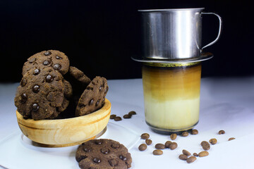 Chocolate granules cookies served with strong Vietnamese drip coffee, bitter coffee and sweet cookies are best served when relaxing such as reading a book or when we need energy