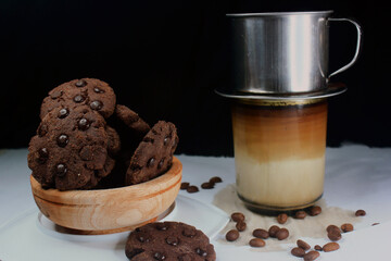 Chocolate granules cookies served with strong Vietnamese drip coffee, bitter coffee and sweet cookies are best served when relaxing such as reading a book or when we need energy
