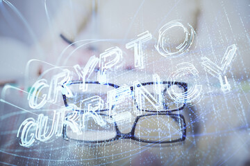 Cryptocurrency hologram over woman's hands writing background. Concept of blockchain. Multi exposure