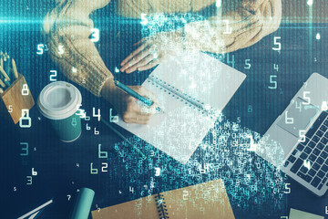 Double exposure of writing hands on background with data solution hologram on front. Technology concept. Close up