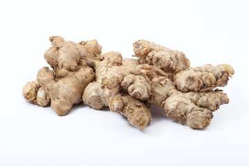 Fresh ginger root or rhizome isolated on white background