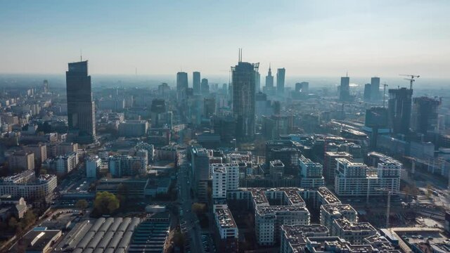 View from the height on Warsaw business center, skyscrapers, buildings and cityscape in the morning fog. Hyperlapse