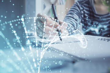 DNA theme hologram over woman's hands writing background. Concept of education. Double exposure