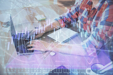 Multi exposure of forex graph with man working on computer on background. Concept of market analysis.