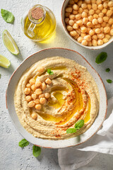 Homemade hummus with mint leaves and lime