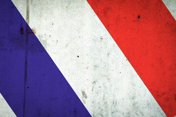 Flag of France on a concrete wall. Travels.