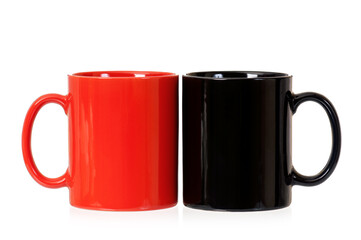 Two perfect cups, isolated on white background. Red and Black Mugs for tea or coffee.