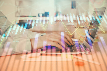 Double exposure of stock market graph with man working on laptop on background. Concept of financial analysis.