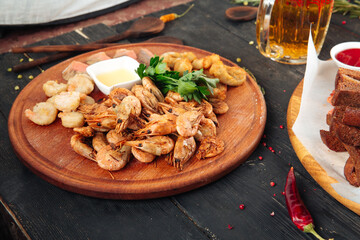 Appetizing beer snack shrimps with sauce 
