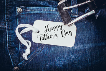 White paper card on deep blue jeans pocket. Father Day concept. Greeting card on a jeans background and space for text. For Father's Day or Birthday.