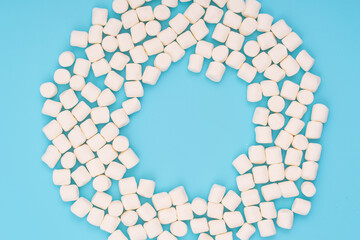 marshmallows on a   turquoise background .