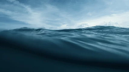 Fotobehang Zee Wave on moving water surface close up in the middle of the screen.  Under Water Surface in the middle of the sea  © Glebstock