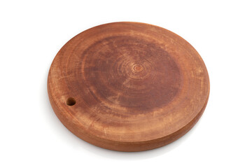 Wooden round cutting board isolated on white background. Side view.