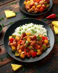 Pineapple and Chicken in sweet and sour sauce with bell pepper, rice and spring onion
