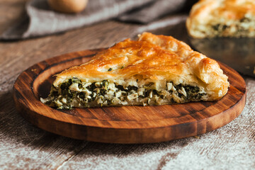 Slice of pie with spinach and cheese filling